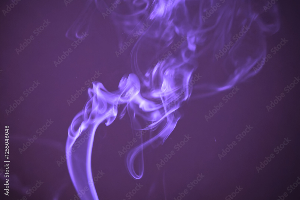Abstract pattern of smoke of glowing incense stick against purple background. Photo taken February 8th, 2025, Zurich, Switzerland. Abstract pattern of smoke of glowing incense stick against purple background. Photo taken February 8th, 2025, Zurich, Switzerland.