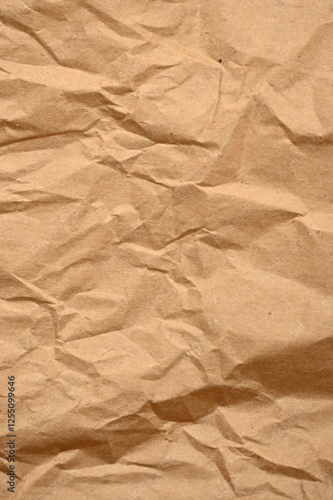 light brown crumpled paper texture as background, old kraft paper as background, crumpled packing material texture as background photo above