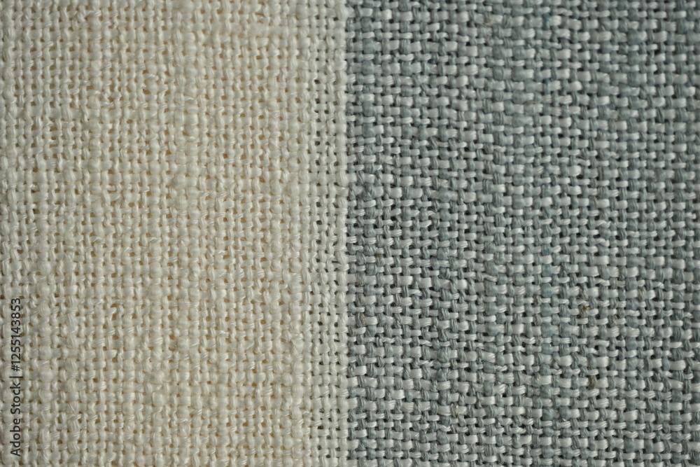 Fototapeta premium Striped fabric texture with beige, red, and gray colors. Textile background with woven pattern for fashion, design, and home decor projects. Natural cotton material close-up.