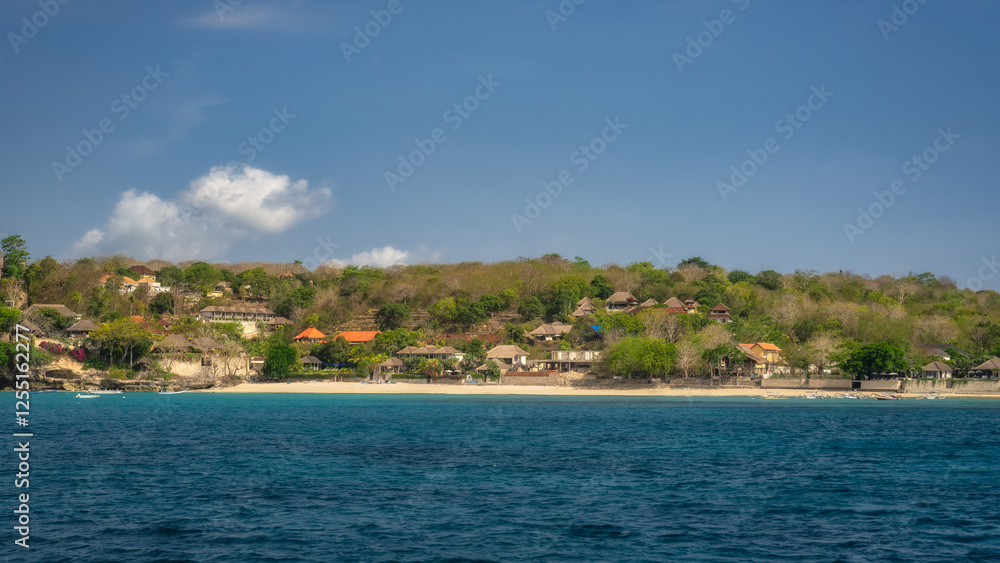 A captivating and beautiful beach scene is on display, showcasing the incredibly clear blue waters alongside a lush coastal landscape all under a bright, sunny sky, Nusa Lembongan, Bali, Indonesia A captivating and beautiful beach scene is on display, showcasing the incredibly clear blue waters alongside a lush coastal landscape all under a bright, sunny sky, Nusa Lembongan, Bali, Indonesia