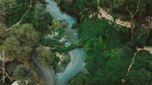 Aerial rising over Blue eye spring a natural phenomenon in Albania