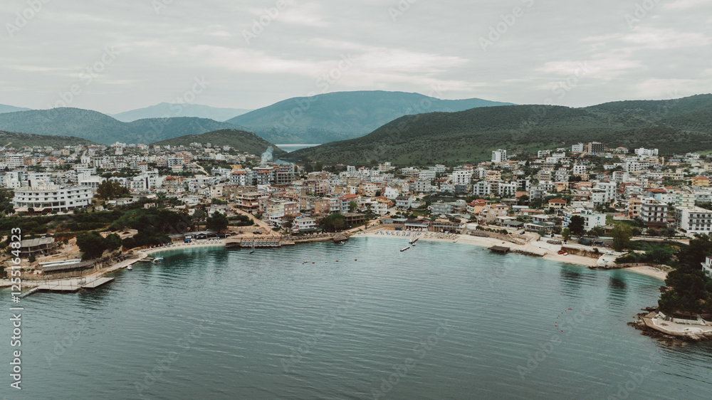 Aerial view of tropical beach in Ksamil Islands with turquoise water, Albania. Exotic paradise coastline. Panorama Balkan coast on Ionian sea. Aerial view of tropical beach in Ksamil Islands with turquoise water, Albania. Exotic paradise coastline. Panorama Balkan coast on Ionian sea.