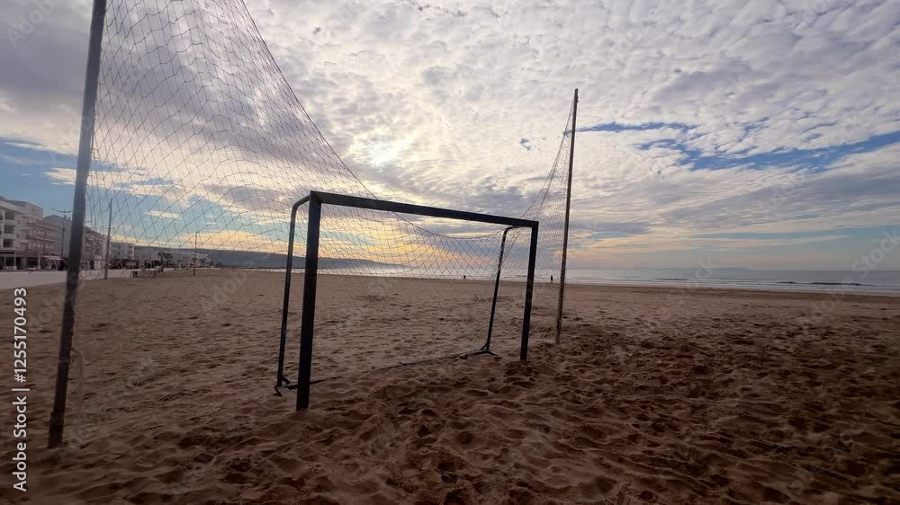 shot from a beach soccer match with the ocean and beach in the background shot from a beach soccer match with the ocean and beach in the background