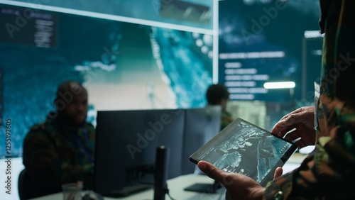 Canvastavla Military officer leads cybersecurity operations in a high tech operation room command post, ensuring data protection