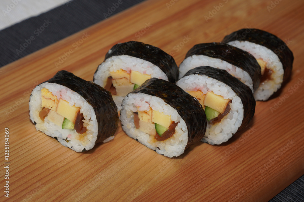 Homemade sushi roll on wood board. Japanese food. Homemade sushi roll on wood board. Japanese food.
