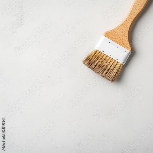 Wooden brush and grout brush on white background with copy space for design or advertising purposes