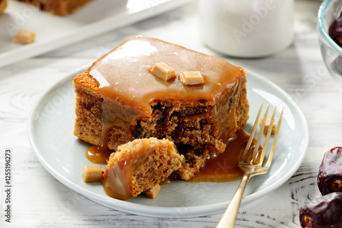 Easy Sticky Toffee Pudding is a deliciously gooey sponge cake drenched in warm toffee sauce.