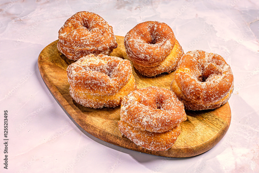 Traditional Spanish anise fritters with sugar coating Traditional Spanish anise fritters with sugar coating