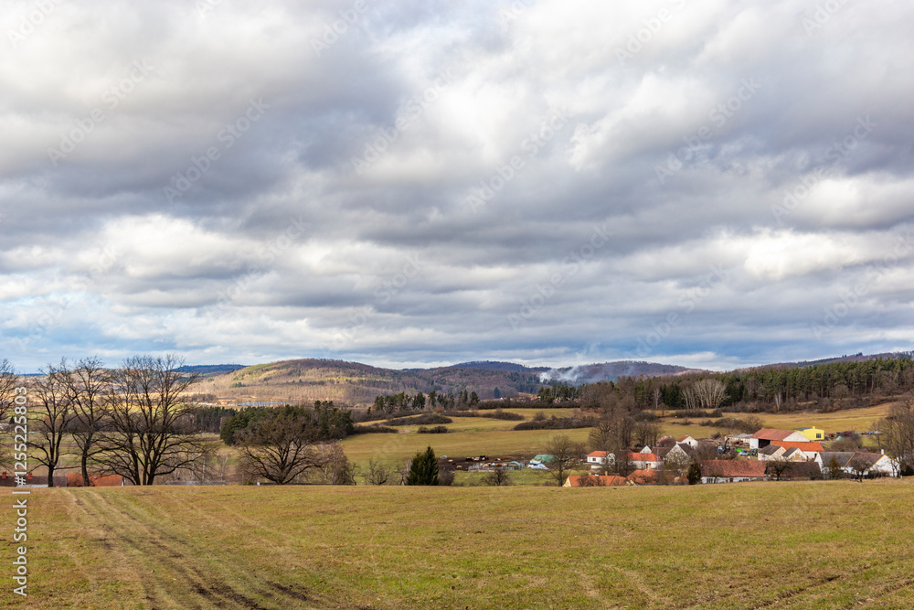 A rural landscape with villages and fields in early spring. South Bohemia, Czechia