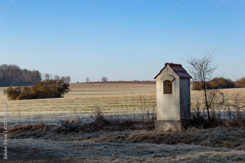 Small chapel near a field. Cold winter morning. Czechia
