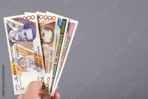 Fotografía Ecuadorian money in the hand on a gray background