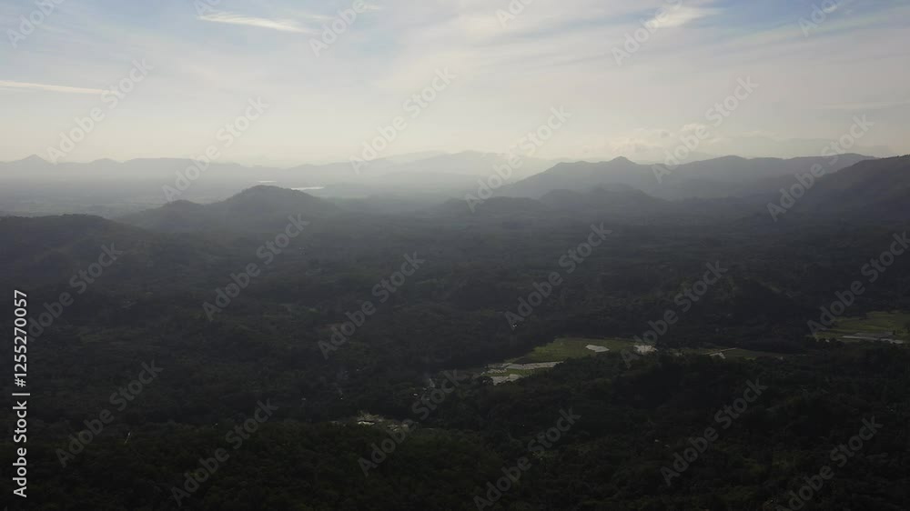 Aerial view of mountains covered with forest and jungle in the morning haze. Sri Lanka. Aerial view of mountains covered with forest and jungle in the morning haze. Sri Lanka.