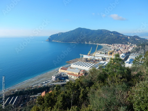 the bay of Riva Trigoso with the shipyard and Punta Manara in the background, Liguria, Italy