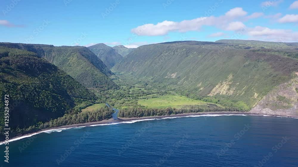 A breathtaking aerial view of Waipio Valley’s black sand beach, lush green cliffs, and winding river flowing into the deep blue ocean on Hawaii’s Big Island. A breathtaking aerial view of Waipio Valley’s black sand beach, lush green cliffs, and winding river flowing into the deep blue ocean on Hawaii’s Big Island.