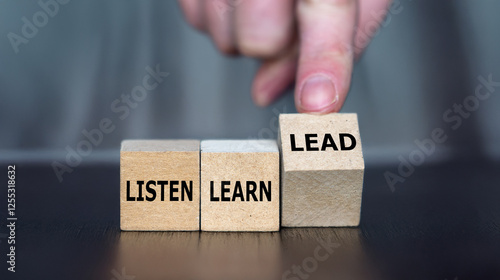 Cubes form the words listen, learn and lead.