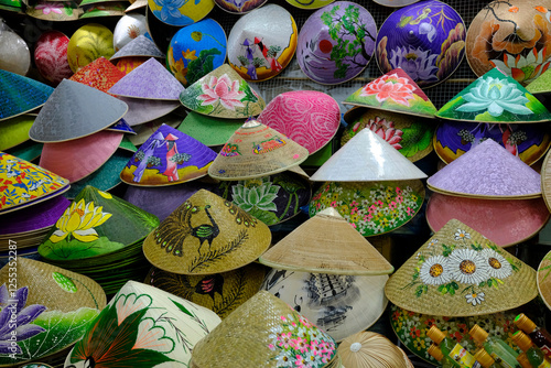 Paddy hats or conical straw hats for sale at a market stall in Dong Ba market. The conical hat is a great symbol of Vietnam.  Hue. Vietnam.