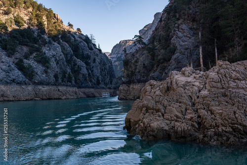 green canyno manavgat in turkey river lake blue lagoon dam cruise ship boat Türkiye Mediterranean wave water poster anatolia taurus mountains sea coast stone wall rocks trees
