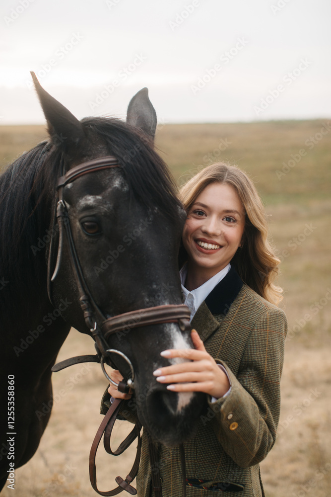 Obraz premium Smiling Woman With Black Horse in Open Field During Daytime