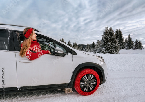 Obraz na płótnie Woman Looking out of Car Window in Winter Forest w salonie