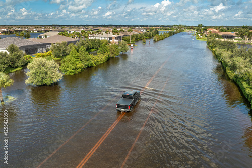Fototapeta Hurricane rainfall flooded road