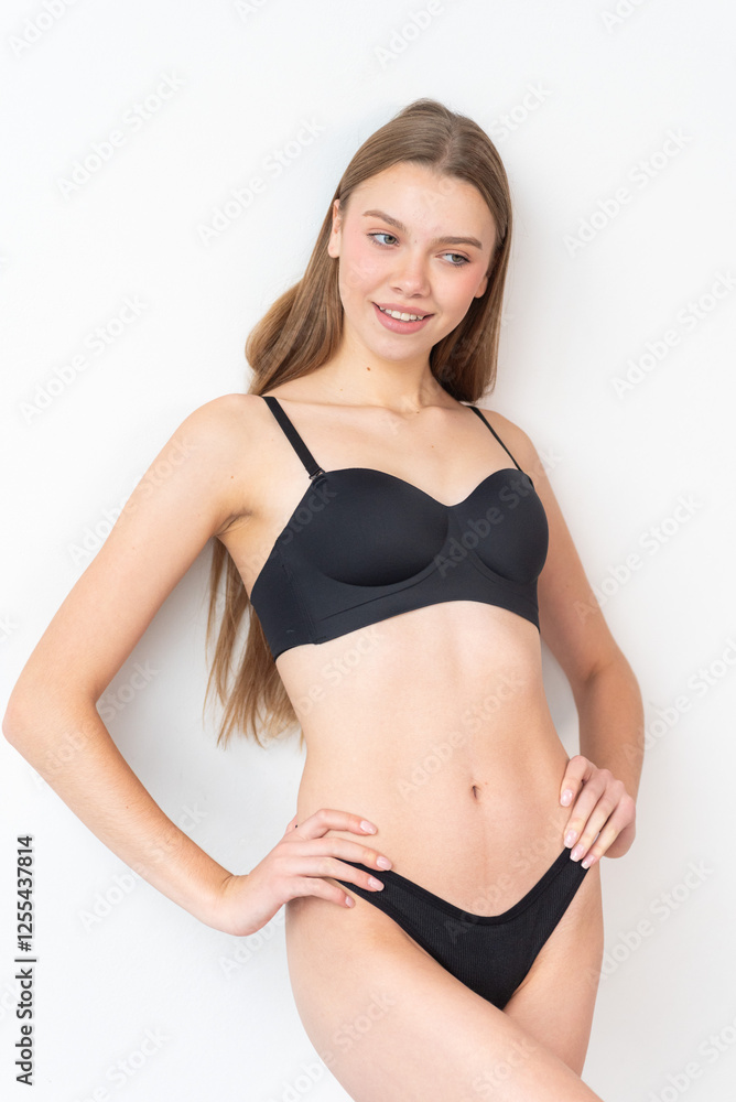 High-quality model polaroid featuring a tall, fit woman in a minimalistic studio environment. Showcasing a neutral expression, toned physique, and poised posture for fashion industry standards High-quality model polaroid featuring a tall, fit woman in a minimalistic studio environment. Showcasing a neutral expression, toned physique, and poised posture for fashion industry standards