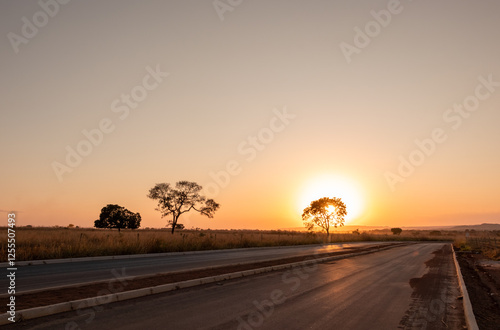 highway with sunset in the countryside photo