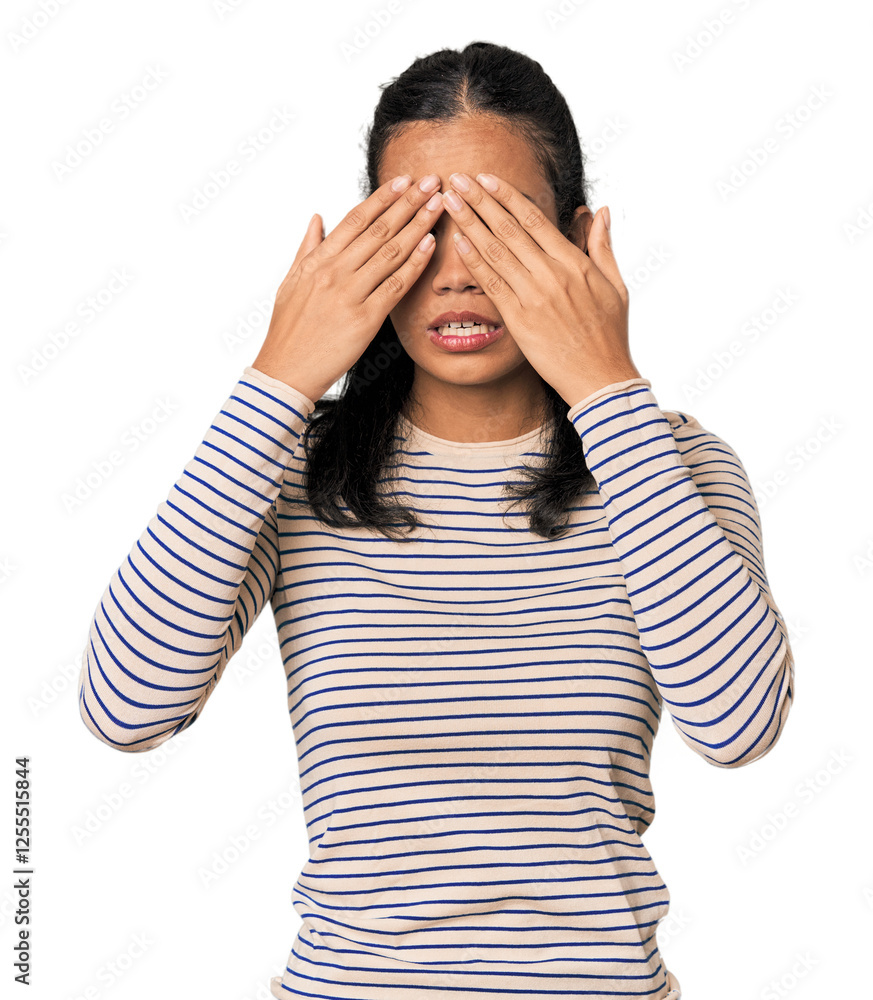 Young Filipina woman afraid covering eyes with hands. Young Filipina woman afraid covering eyes with hands.