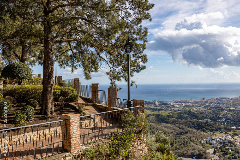 Terrace park along the mountain edge of tourist destination town Mijas in Spain looking over the Mediterranean Costa del Sol landscape Terrace park along the mountain edge of tourist destination town Mijas in Spain looking over the Mediterranean Costa del Sol landscape