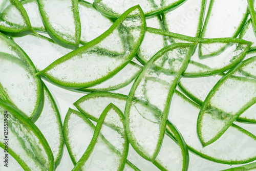 Thin aloe vera pieces, transparent shot against the light. Texture and structure of aloe vera inner gel. photo