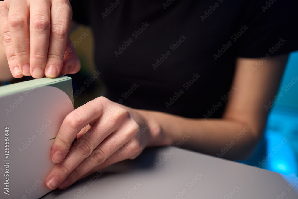 A gentle and caring hand is cradling a beautiful, vibrant plant placed on a charming wooden surface A gentle and caring hand is cradling a beautiful, vibrant plant placed on a charming wooden surface