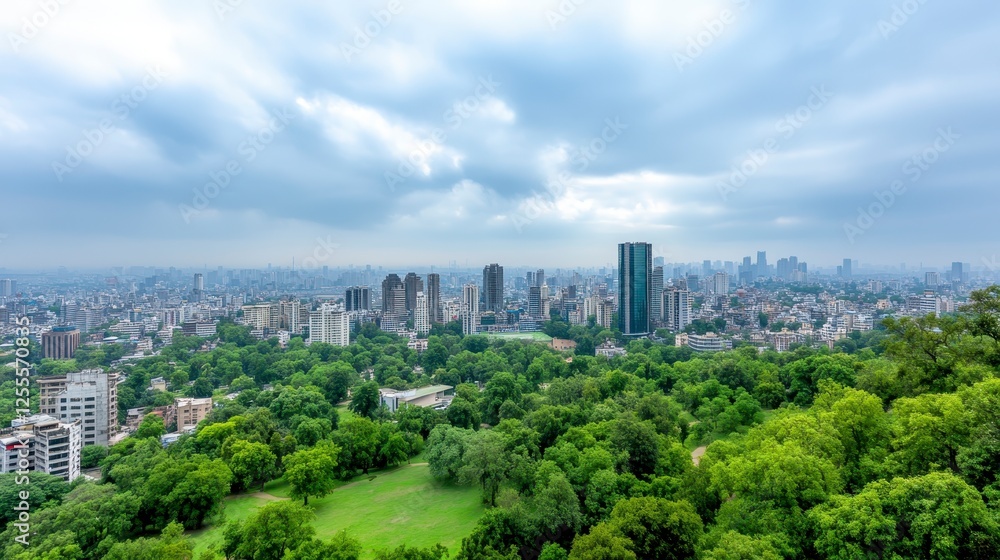High angle panoramic view of a large urban area spread across a valley, surrounded by lush green trees and parks. Gray white clouds cover much of the High angle panoramic view of a large urban area spread across a valley, surrounded by lush green trees and parks. Gray white clouds cover much of the