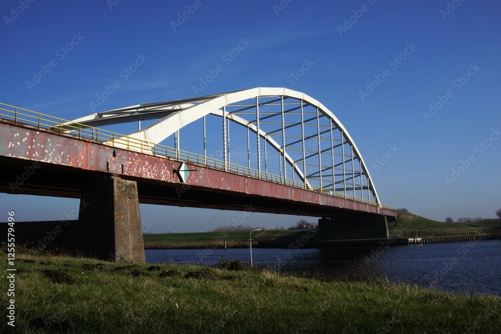 Obraz premium Bridge in the Netherlands, Europe. The Slaak Bridge that connects Brabant and Zeeland. A steel construction that connects roads and makes land accessible for transport via the motorway over the inland
