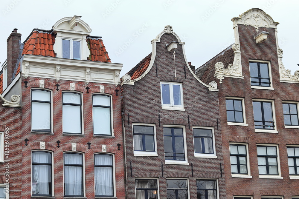 Fototapeta premium Amsterdam Singel Canal House Facades Close Up with White Sky, Netherlands