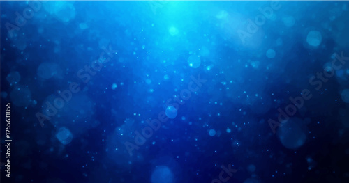 backdrop of abstract bokeh particles in blue light