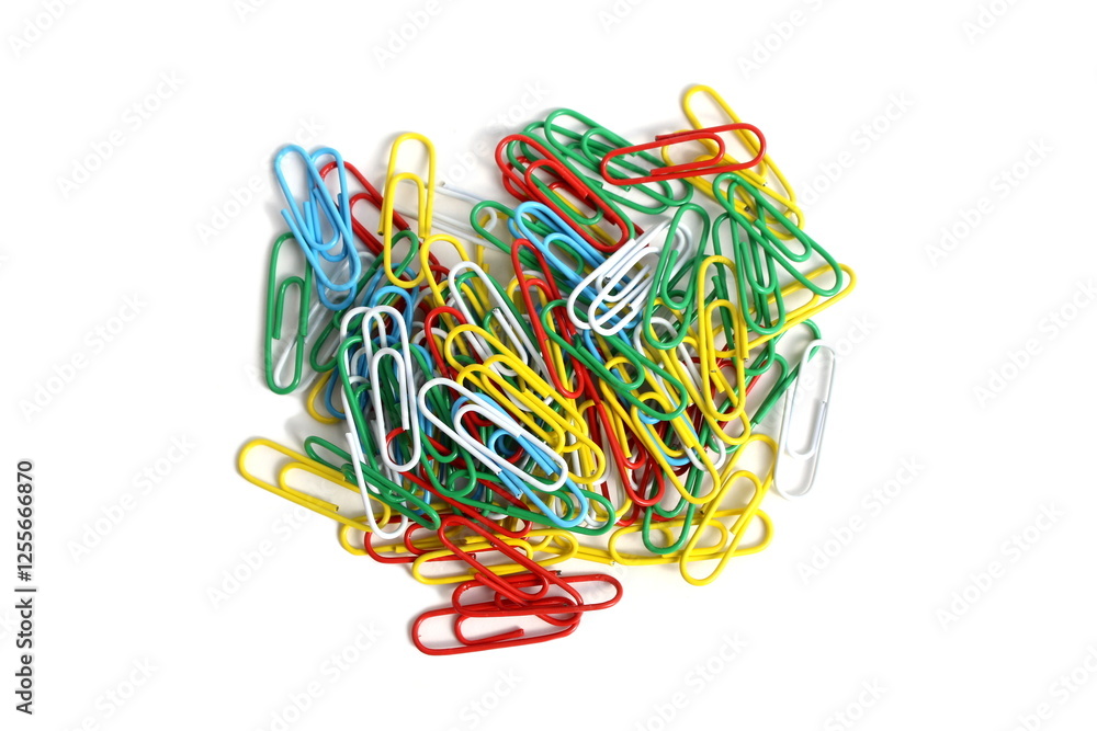 There are brightly colored paper clips on a white background. There are brightly colored paper clips on a white background.