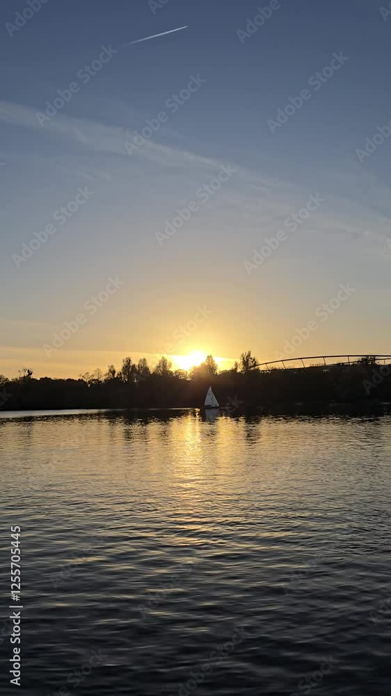 The calm beauty of a serene sunset gracefully reflected over tranquil water and landscapes Hannover Maschsee The calm beauty of a serene sunset gracefully reflected over tranquil water and landscapes Hannover Maschsee