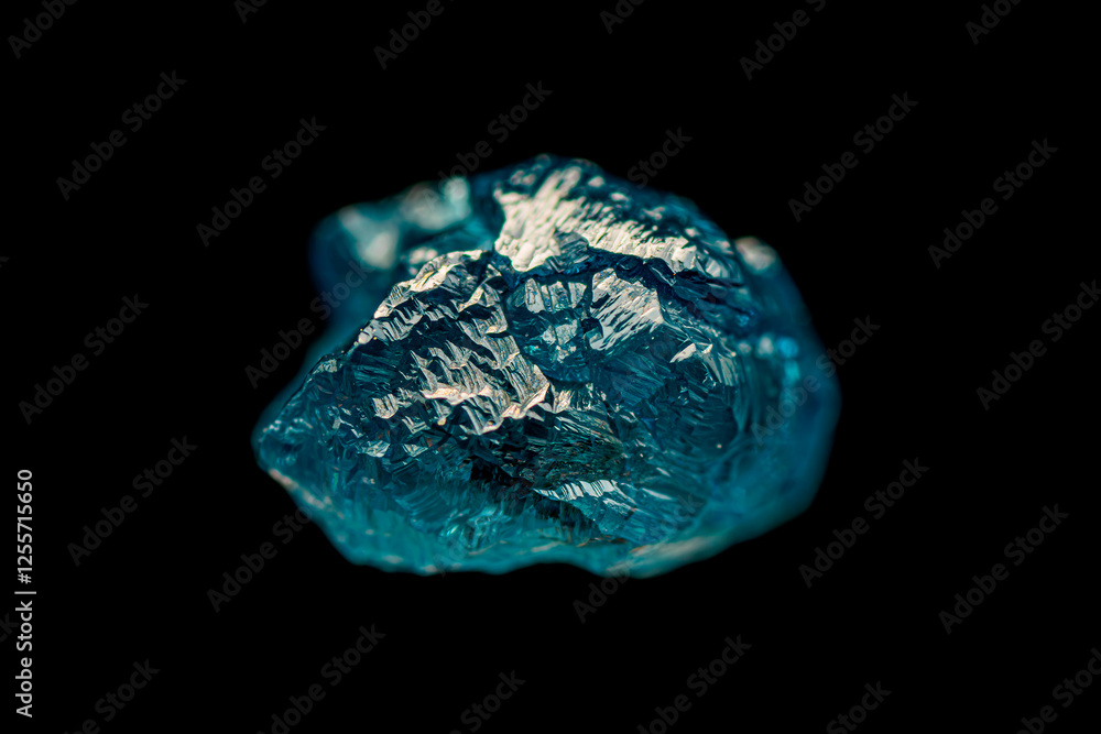 Fototapeta premium Closeup natural rough blue diamond on dark background (selective focus)