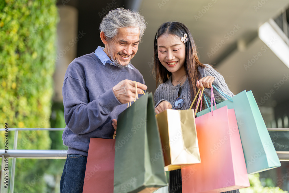 Father and daughter happy excited shopping together checking items in shopping bags, family joy, retail, sale, store experience, discounts, weekend shopping relationship unpacking gifts at mall Father and daughter happy excited shopping together checking items in shopping bags, family joy, retail, sale, store experience, discounts, weekend shopping relationship unpacking gifts at mall