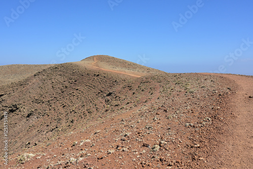 Hike in the nature park Caminos Naturales to the volcanes de Bayuyo, Fuerteventura, Canary Islands photo