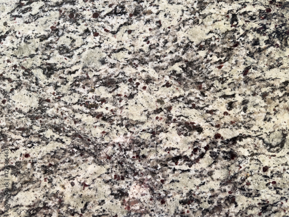 Natural granite surface showcasing intricate patterns and textures in neutral tones Natural granite surface showcasing intricate patterns and textures in neutral tones