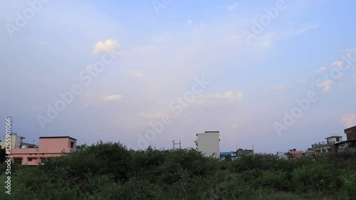 The sun is setting and the wind is blowing in the evening. sky is turnin red. A beautiful scene. A village in Dehradun. Uttarakhand. india. 05- 26-2020 photo