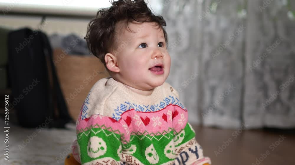 Happy baby boy sitting, smiling and playing with a yellow ring. baby play concept. Happy baby boy sitting, smiling and playing with a yellow ring. baby play concept.