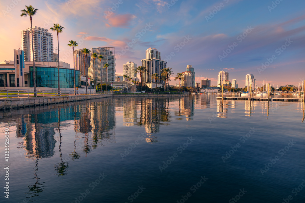 St. Petersburg, Florida, USA. Cityscape image of St. Petersburg, Florida with reflection of the city skyline in the water at beautiful sunset.
