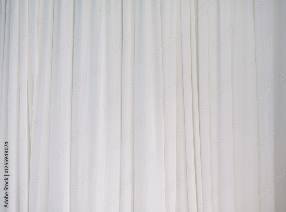 The white curtains are wavy and flowing. The white curtains are wavy and flowing.