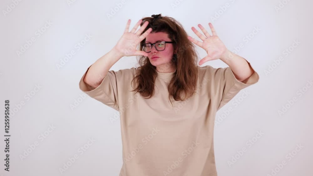 plus size woman, body positive, disco dance of 70s 80s. spreads arms, closing, revealing face open palms of her hands isolated on white studio background. At end, he blows kiss, stands confident pose plus size woman, body positive, disco dance of 70s 80s. spreads arms, closing, revealing face open palms of her hands isolated on white studio background. At end, he blows kiss, stands confident pose