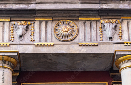 Animal skulls on the medieval houses walls photo