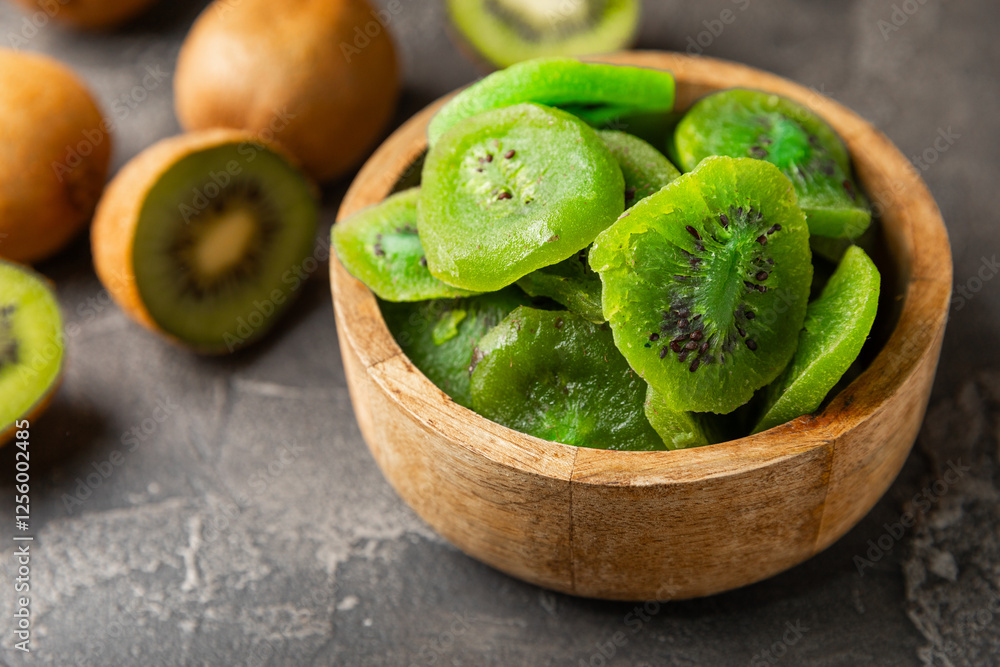Kiwi dried fruit on wooden background. kiwi candied fruit. Healthy food. Ingredient for baking cupcakes. Healthy snack, vegetarian sweets. Space for text. Copy space