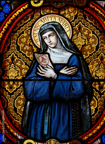 Stained glass (19th century) of St. Margaret Mary Alacoque or Sainte Marguerite Marie Alacoque. .