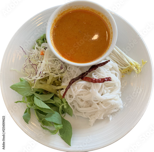 isolated photo of Thai Rice Noodles in spicy Fish curry. Kanom Cheen Num Ya ,Fresh Thai rice noodle and a fish based sauce, Served with vegetables, dried chillies and basil. Thai food photo