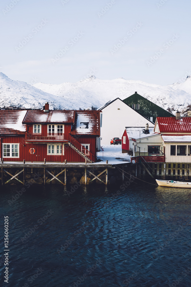 Fototapeta premium Small local houses on coast in snow
